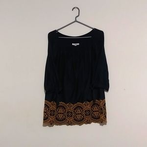 Navy blue top with gold tat